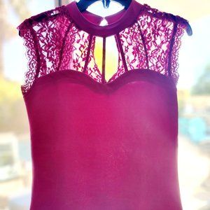 Fuscia sleevless blouse with 3 button key hole back with peek a boo lace